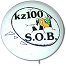 wooden plaque with a cutout of the Z100 buzzard and the Z100 logo. Inscription reads “For those who give the rewards are high. Here's yours”